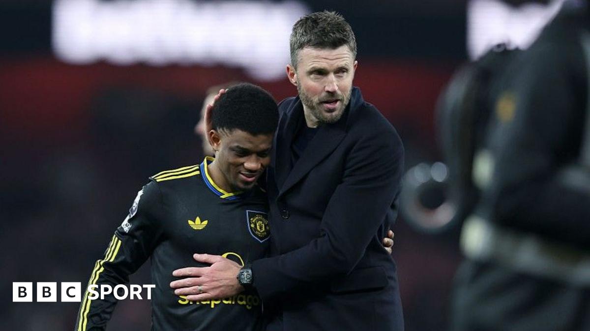 Manchester United winger Amad Diallo (left) with head coach Michael Carrick