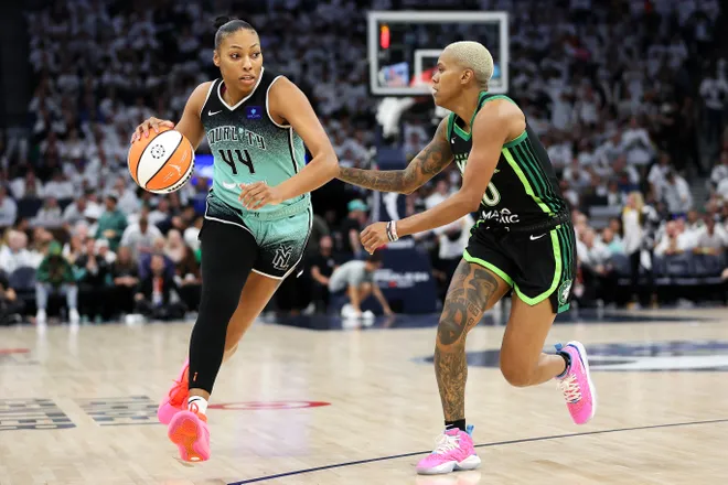 Oct 18, 2024; Minneapolis, Minnesota, USA; New York Liberty forward Betnijah Laney-Hamilton (44) drives past Minnesota Lynx guard Courtney Williams (10) during the second half of game four of the 2024 WNBA Finals at Target Center. Mandatory Credit: Matt Krohn-Imagn Images