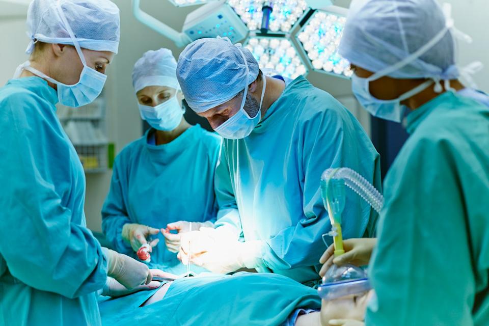 Surgeons performing an operation.