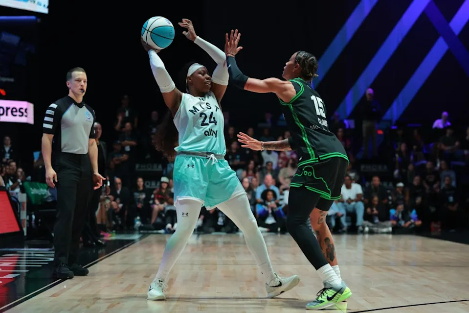 Mist wing Arike Ogunbowale (24) protects the basketball from Phantom wing Natasha Cloud (15) during the first half of the Unrivaled championship game. Sam Navarro-Imagn Images