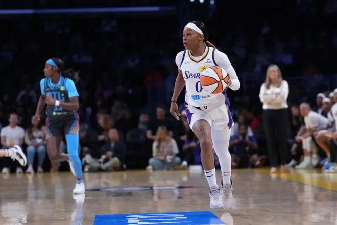 May 27, 2025; Los Angeles, California, USA; LA Sparks guard Odyssey Sims (0) dribbles the ball against the Atlanta Dream in the first half at Crypto.com Arena. Mandatory Credit: Kirby Lee-Imagn Images