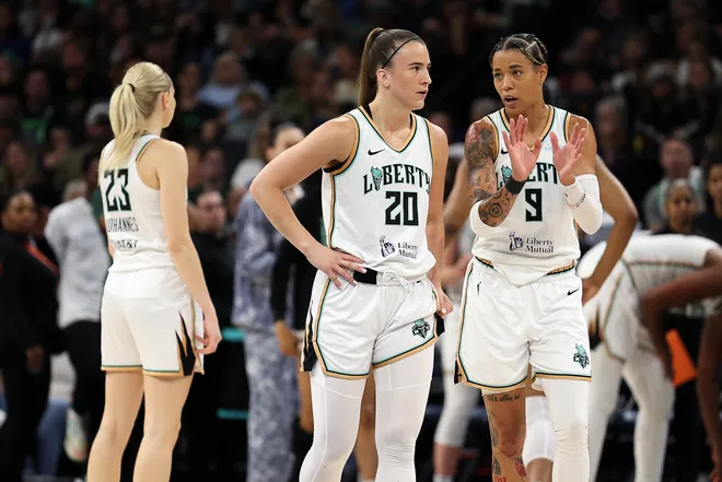 Aug 16, 2025; Minneapolis, Minnesota, USA; New York Liberty guard Natasha Cloud (9) talks with guard Sabrina Ionescu (20) during the third quarter against the Minnesota Lynx at Target Center. Mandatory Credit: Matt Krohn-Imagn Images