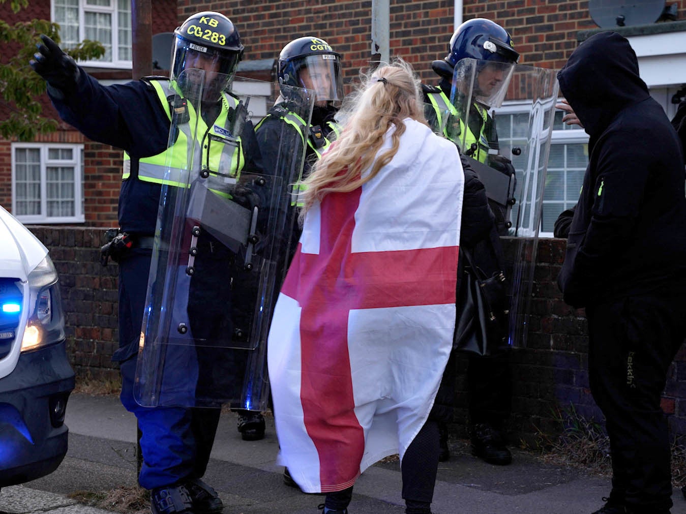 Demonstrators gathered on a residential street in Epsom on Monday evening with riot police at the scene