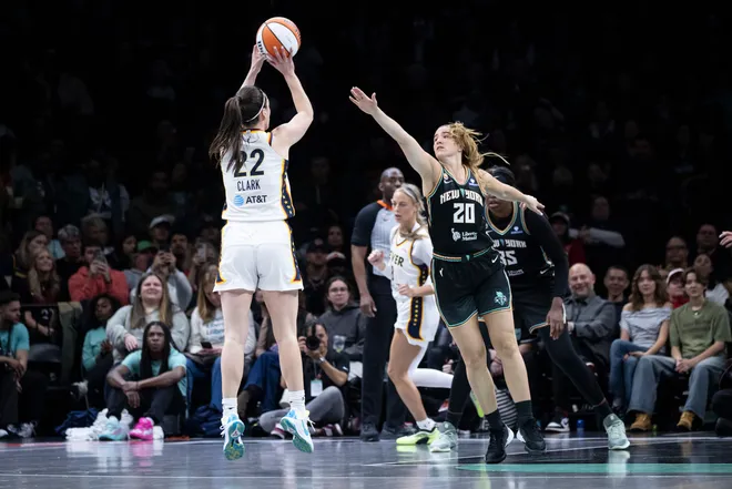 BROOKLYN, NEW YORK - APRIL 25: Caitlyn Clark #22 of the Indiana Fever gets shot up over Sabrina Ionescu #20 of the New York Liberty at Barclays Center on April 25, 2026 in Brooklyn, New York. NOTE TO USER: User expressly acknowledges and agrees that, by downloading and or using this Photograph, user is consenting to the terms and conditions of the Getty Images License Agreement. (Photo by Michelle Farsi/Getty Images)