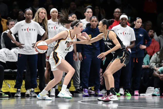 Apr 25, 2026; Brooklyn, NY, USA; Indiana Fever guard Caitlin Clark (22) tries to drive past New York Liberty guard Rebekah Gardner (7) during the first half at Barclays Center. Mandatory Credit: John Jones-Imagn Images
