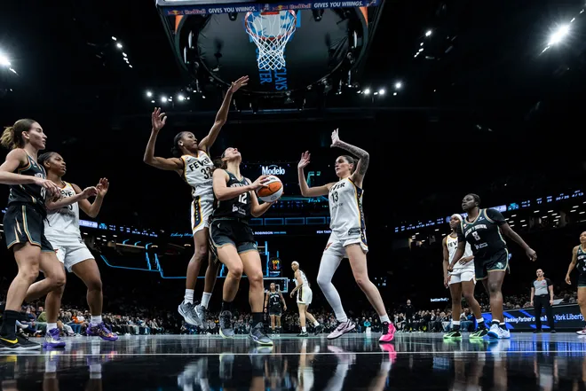 BROOKLYN, NEW YORK - APRIL 25: Shatori Walker-Kimbrough #32 and Justine Pissott #13 of the Indiana Fever defend against Alex Fowler #12 of the New York Liberty during a preseason matchup at Barclays Center on April 25, 2026 in Brooklyn, New York. NOTE TO USER: User expressly acknowledges and agrees that, by downloading and or using this Photograph, user is consenting to the terms and conditions of the Getty Images License Agreement. (Photo by Michelle Farsi/Getty Images)