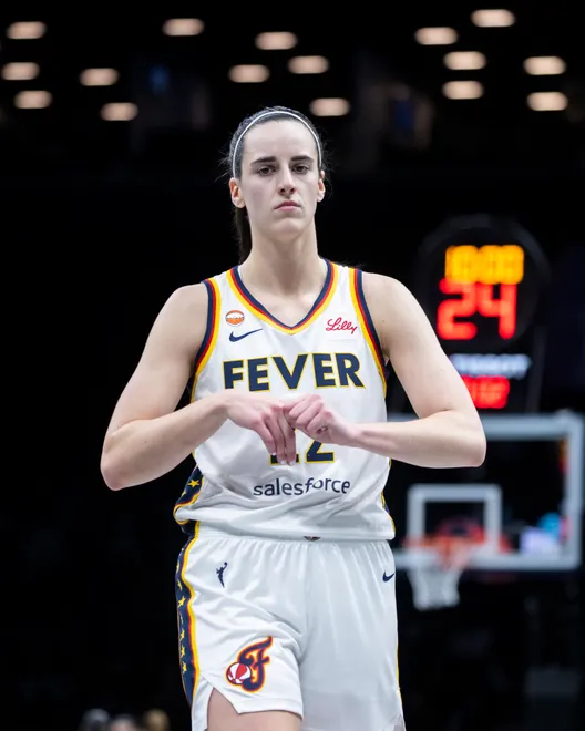 BROOKLYN, NEW YORK - APRIL 25: Caitlin Clark #22 looks on during game against the New York Liberty at Barclays Center on April 25, 2026 in Brooklyn, New York. NOTE TO USER: User expressly acknowledges and agrees that, by downloading and or using this Photograph, user is consenting to the terms and conditions of the Getty Images License Agreement. (Photo by Michelle Farsi/Getty Images)