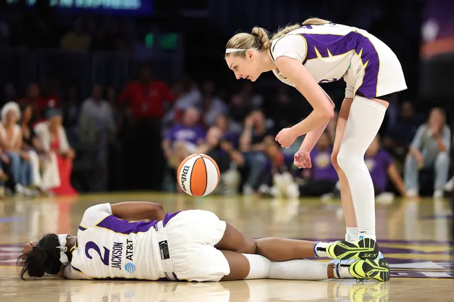 Cameron Brink #22 rushes to the aid of an injured Rickea Jackson #2 of the Los Angeles Sparks.