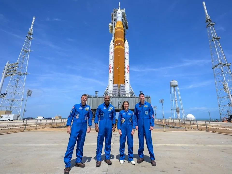  This NASA handout image shows NASA astronauts Reid Wiseman, Artemis II commander (L), Victor Glover, Artemis II pilot (2L), Christina Koch, Artemis II mission specialist (2R), and CSA (Canadian Space Agency) astronaut Jeremy Hansen, Artemis II mission specialist (R), as they stop for a group photo during a visit to NASA’s Artemis II SLS (Space Launch System) rocket and Orion spacecraft, on March 30, 2026, at Launch Complex 39B of NASA’s Kennedy Space Center in Florida.