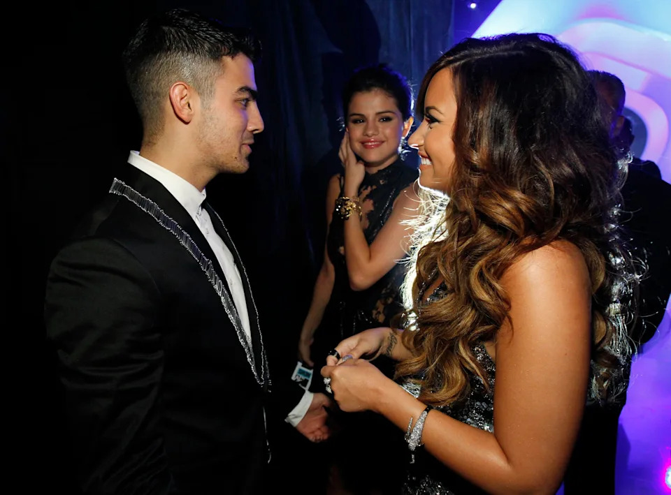 Joe Jonas, Selena Gomez and Demi Lovato arrive at the 2011 MTV Video Music Awards on Aug. 28, 2011, in Los Angeles.