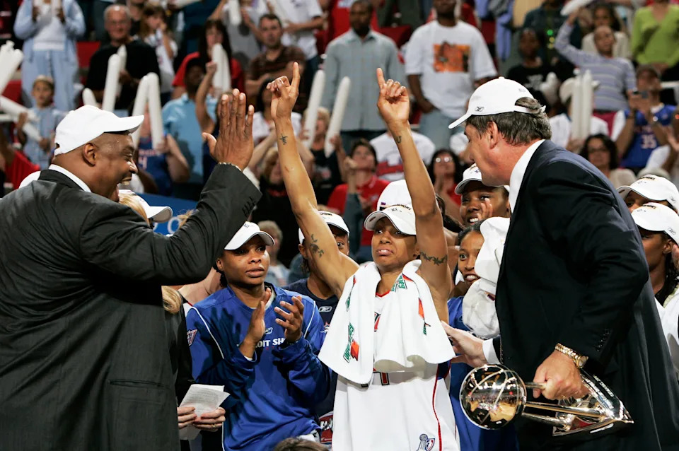 Shock assistant coach Rick Mahorn, from left, Deanna Nolan and head coach Bill Laimbeer celebrate their victory as the Detroit Shock defeated the Sacramento Monarchs in Game 5 of the 2006 WNBA Finals. It was the Shock's second of three WNBA titles.