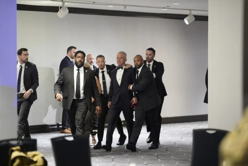 Secretary of Health and Human Services Robert F. Kennedy, Jr is evacuated from the Washington Hilton after shots were heard during the White House Correspondents' Dinner in Washington, D.C., on Saturday night. Photo by Yuri Gripas/UPI