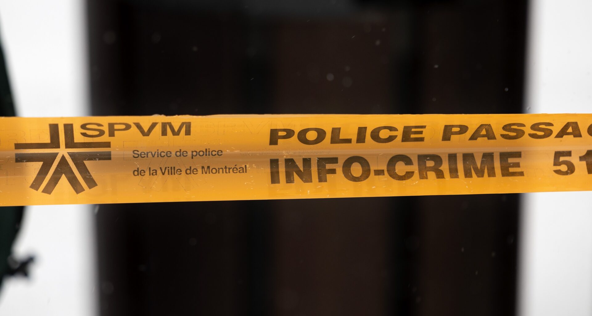 Montreal police tape blocks access to a street in Montreal, on Sunday, March 22, 2026.