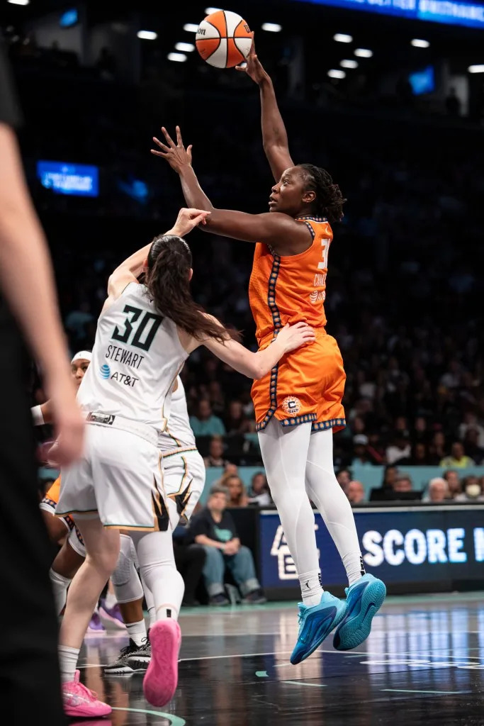 Tina Charles #31 of the Connecticut Sun makes shot over Breanna Stewart #30 of the New York Liberty during a regular season matchup at Barclays Center . Michelle Farsi/New York Post