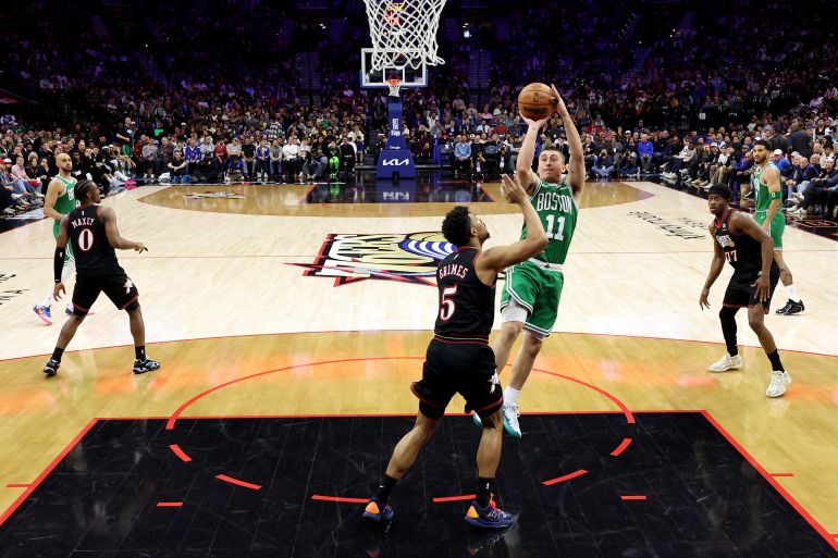 PHILADELPHIA, PENNSYLVANIA - APRIL 26: Payton Pritchard #11 of the Boston Celtics shoots against Quentin Grimes #5 of the Philadelphia 76ers during the second half of game four of the Eastern Conference first round playoffs at Xfinity Mobile Arena on April 26, 2026 in Philadelphia, Pennsylvania. NOTE TO USER: User expressly acknowledges and agrees that, by downloading and or using this photograph, User is consenting to the terms and conditions of the Getty Images License Agreement. Emilee Chinn/Getty Images/AFP (Photo by Emilee Chinn / GETTY IMAGES NORTH AMERICA / Getty Images via AFP)