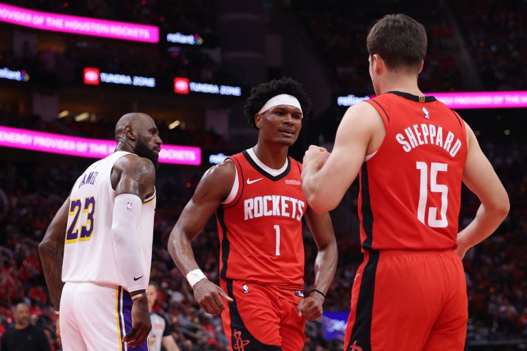 HOUSTON, TEXAS - APRIL 26: Amen Thompson #1 celebrates with Reed Sheppard #15 of the Houston Rockets as LeBron James #23 of the Los Angeles Lakers looks on during the first half in Game Four of the First Round of the NBA Western Conference Playoffs at Toyota Center on April 26, 2026 in Houston, Texas. NOTE TO USER: User expressly acknowledges and agrees that, by downloading and or using this photograph, User is consenting to the terms and conditions of the Getty Images License Agreement. Tim Warner/Getty Images/AFP (Photo by Tim Warner / GETTY IMAGES NORTH AMERICA / Getty Images via AFP)