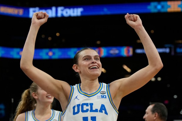 UCLA guard Gabriela Jaquez (11) celebrates after UCLA defeated Texas in a women's NCAA college basketball tournament semifinal game at the Final Four, Friday, April 3, 2026, in Phoenix. (AP Photo/Ross D. Franklin)