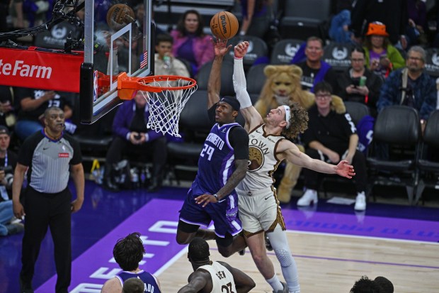 Sacramento Kings' Daeqwon Plowden (29) goes up for a basket while Golden State Warriors' Brandin Podziemski (2) attempts to block his shot in the third quarter of their NBA game at Golden 1 Center in Sacramento, Calif., on Friday, April 10, 2026. (Jose Carlos Fajardo/Bay Area News Group)