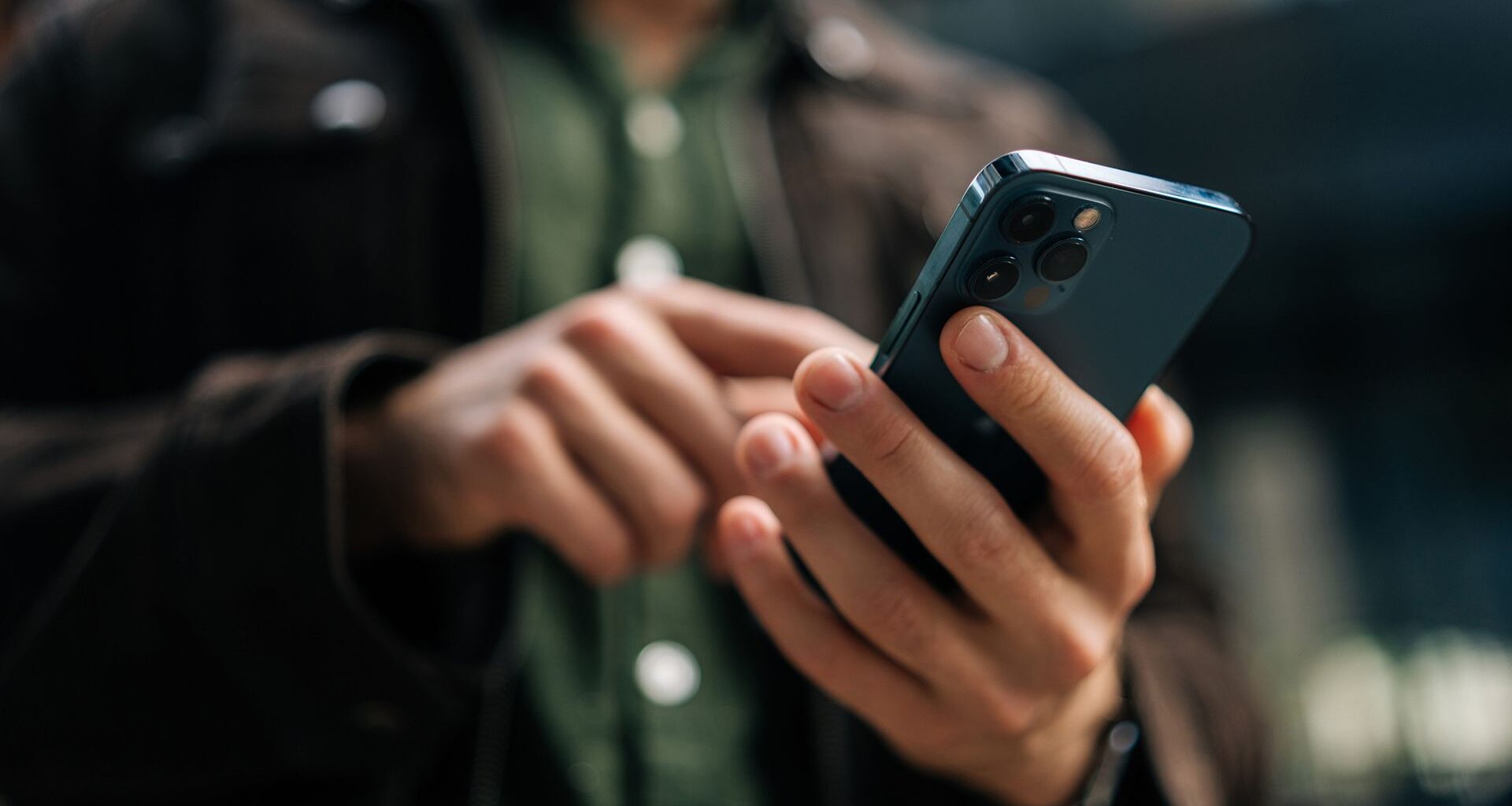Close-up of a phone being used by a man