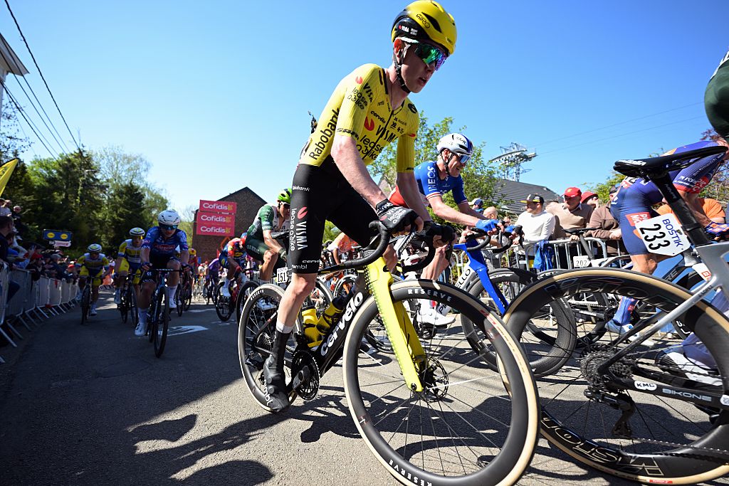 Side shot of. Jorgen Nordhagen riding in the peloton