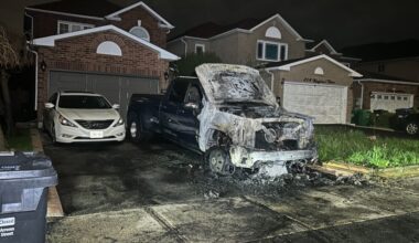 Emergency crews were called to 216 Kingknoll Drive, near Steeles Avenue West and Mavis Road, around 2:50 a.m. for reports of a vehicle engulfed in flames in a residential driveway. Photo: Giancarlo DeSantis/CityNews.