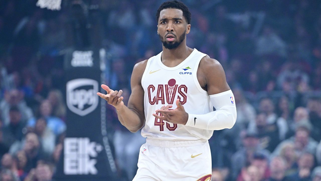Cleveland Cavaliers guard Donovan Mitchell celebrates after making a three-point basket in the first half of an NBA basketball game against the Sacramento Kings, Friday, Jan. 23, 2026, in Cleveland. (AP Photo/David Dermer)