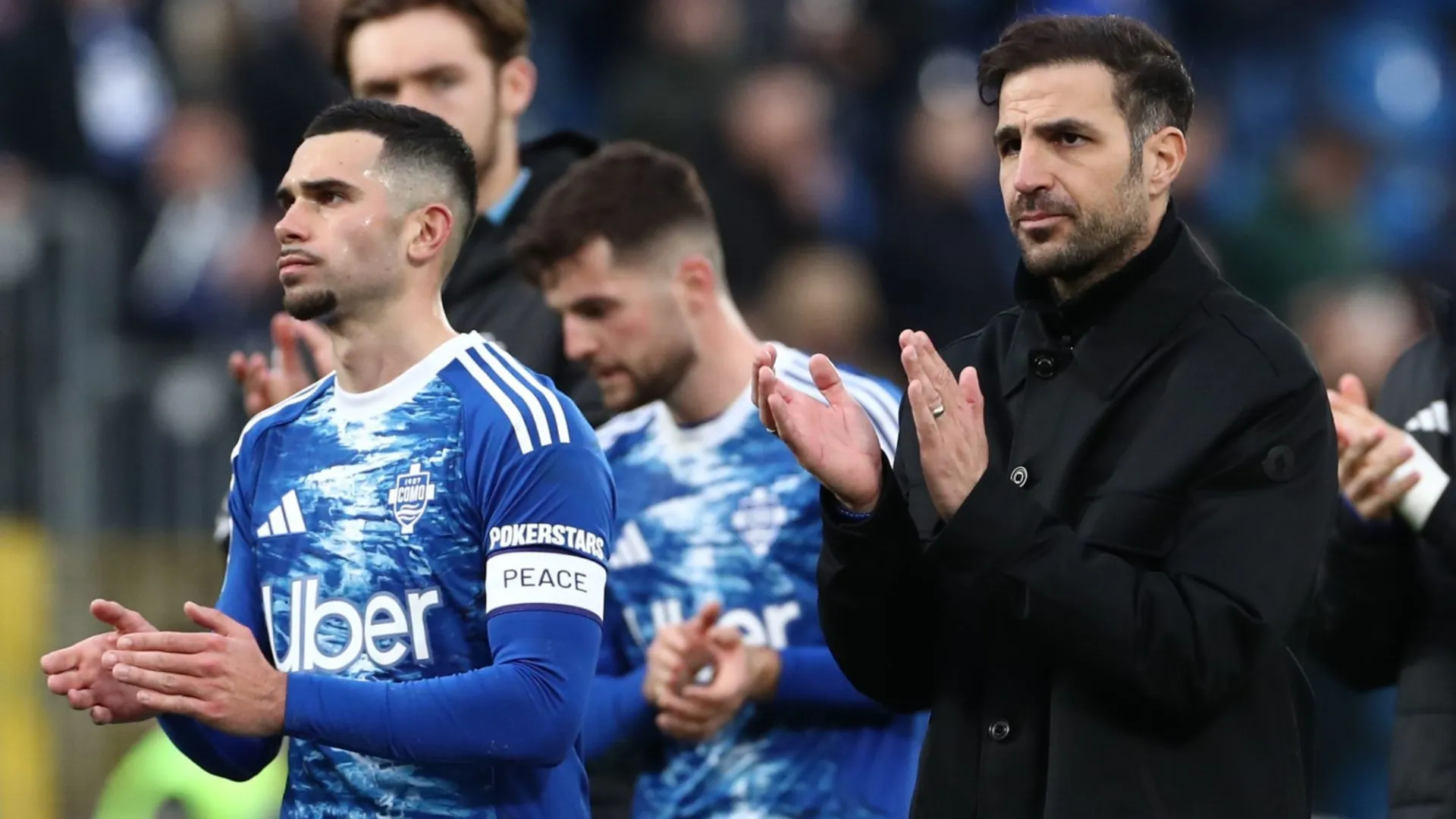 Como 1907 coach Cesc Fabregas reacts salutes the fans at the end of the Serie A match.