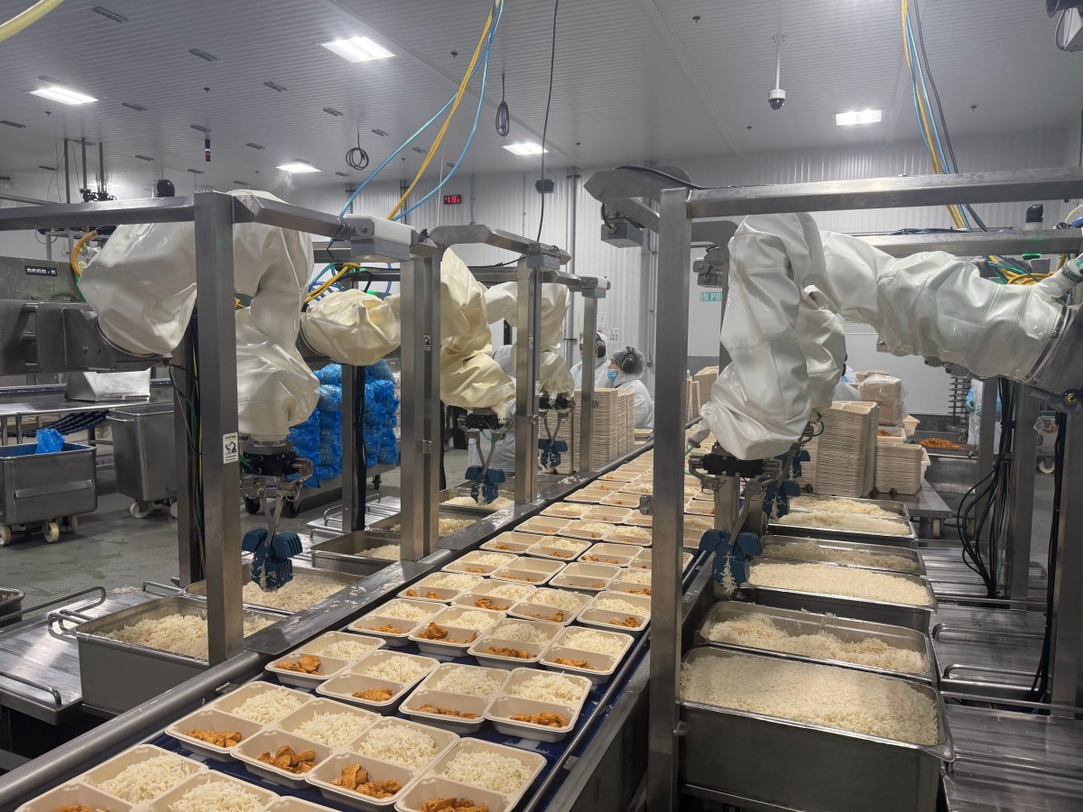 Chef robots deposit rice at Chef Bombay