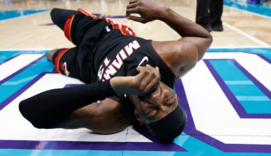 Heat's Bam Adebayo taken to locker room after LaMelo Ball trips him, leading to hard fall