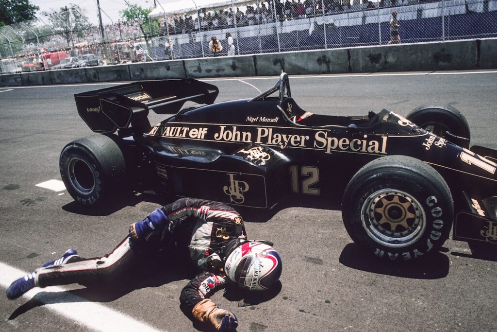 Nigel Mansell, exhausted after pushing his Lotus after finishing the Dallas Grand Prix in sixth position.