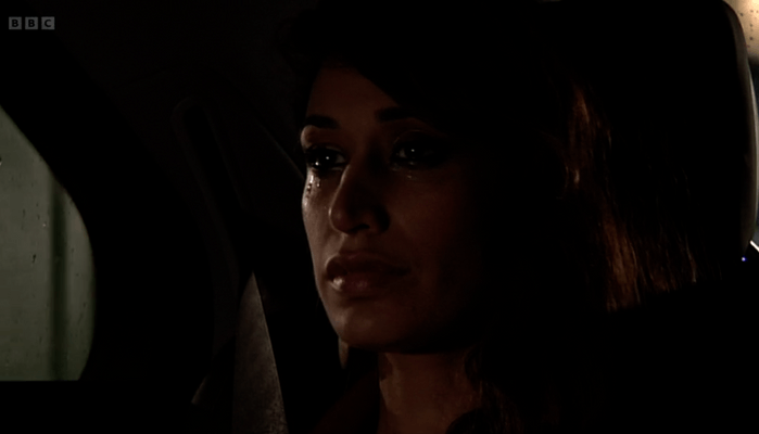 EastEnders Amira exit Amira Masood in the back of a car at night in EastEnders.
