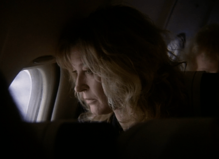EastEnders Kathys exit 1998 Gillian Taylforth as Kathy Mitchell looks out of an airplane window in a scene from EastEnders.