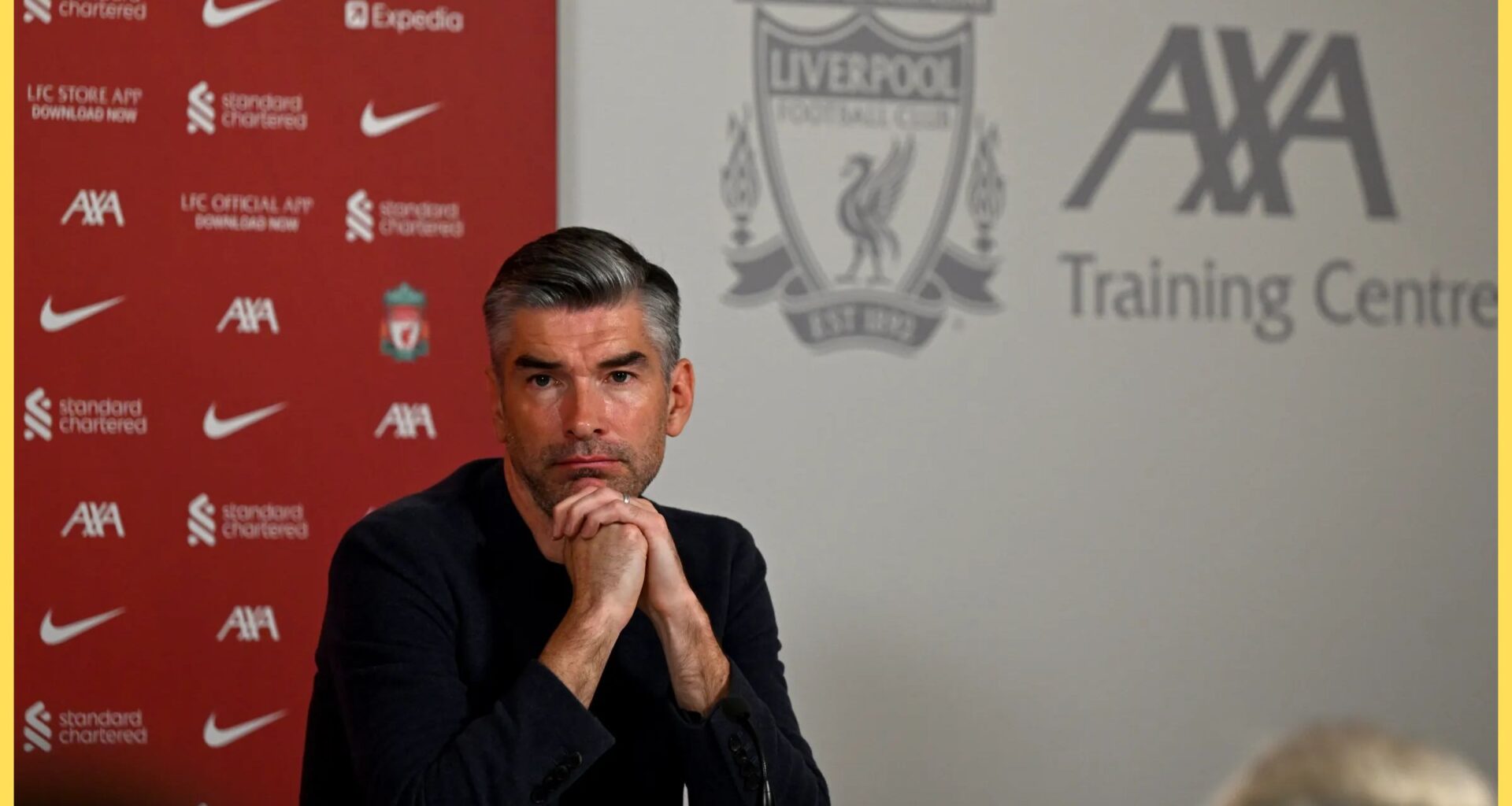 Richard Hughes rests his chin on his hands.