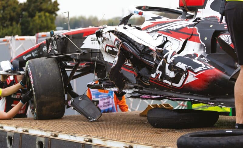 Damaged F1 race car loaded onto recovery truck after Suzuka crash 2026