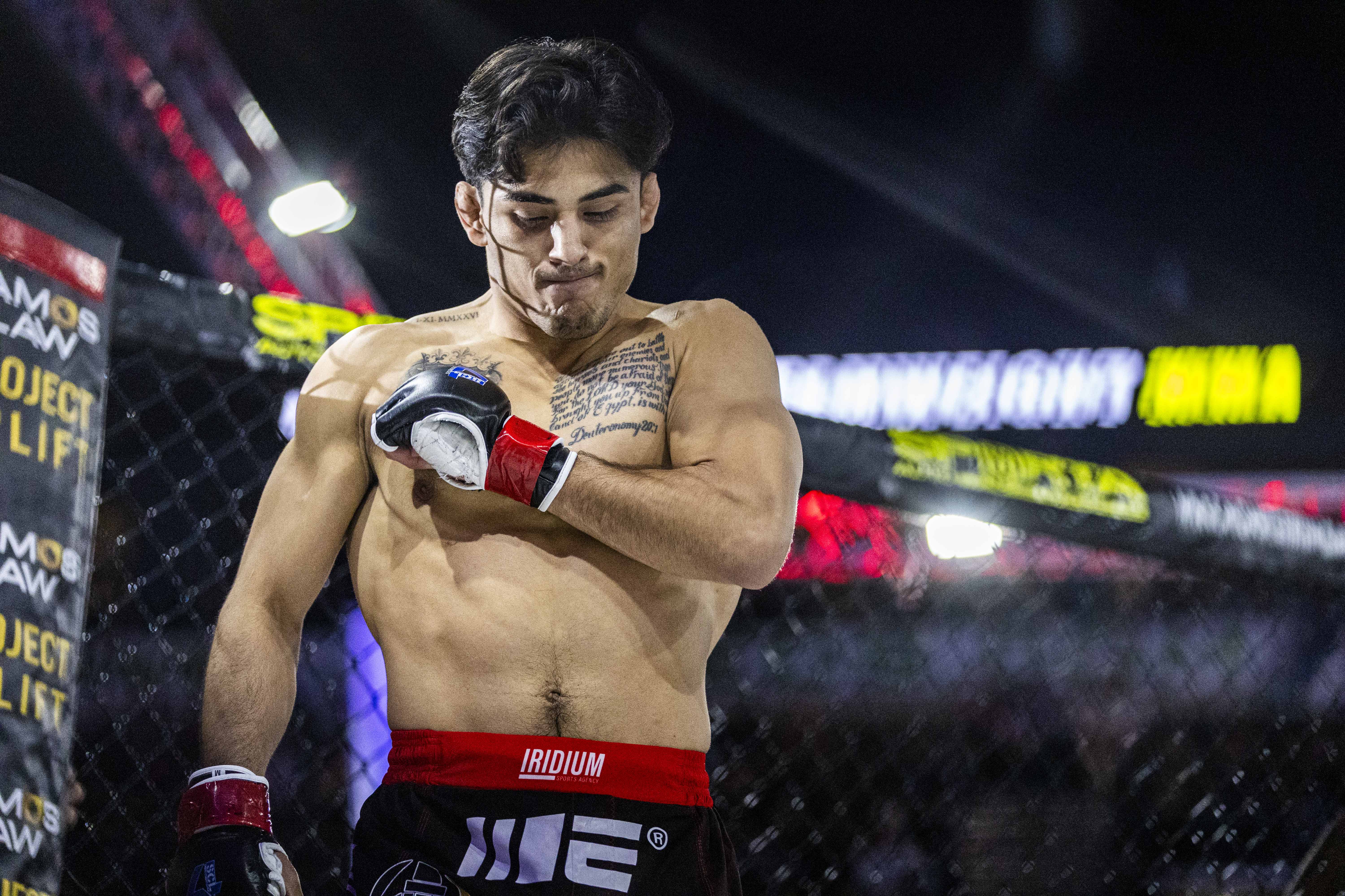 Andrew Alirez beats his chest as he enters the octagon...