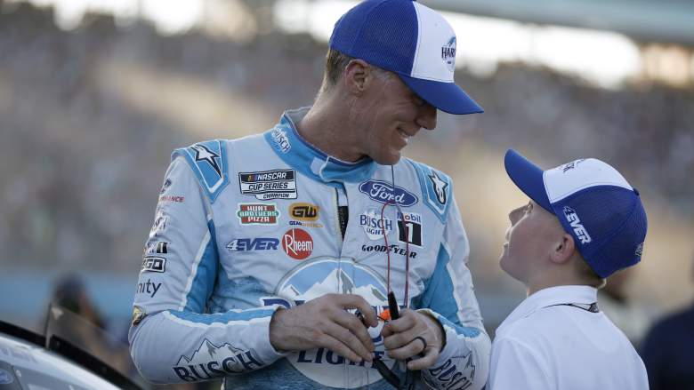 Kevin Harvick talks with his son Keelan Harvick at Phoenix Raceway during the NASCAR Cup Series Championship
