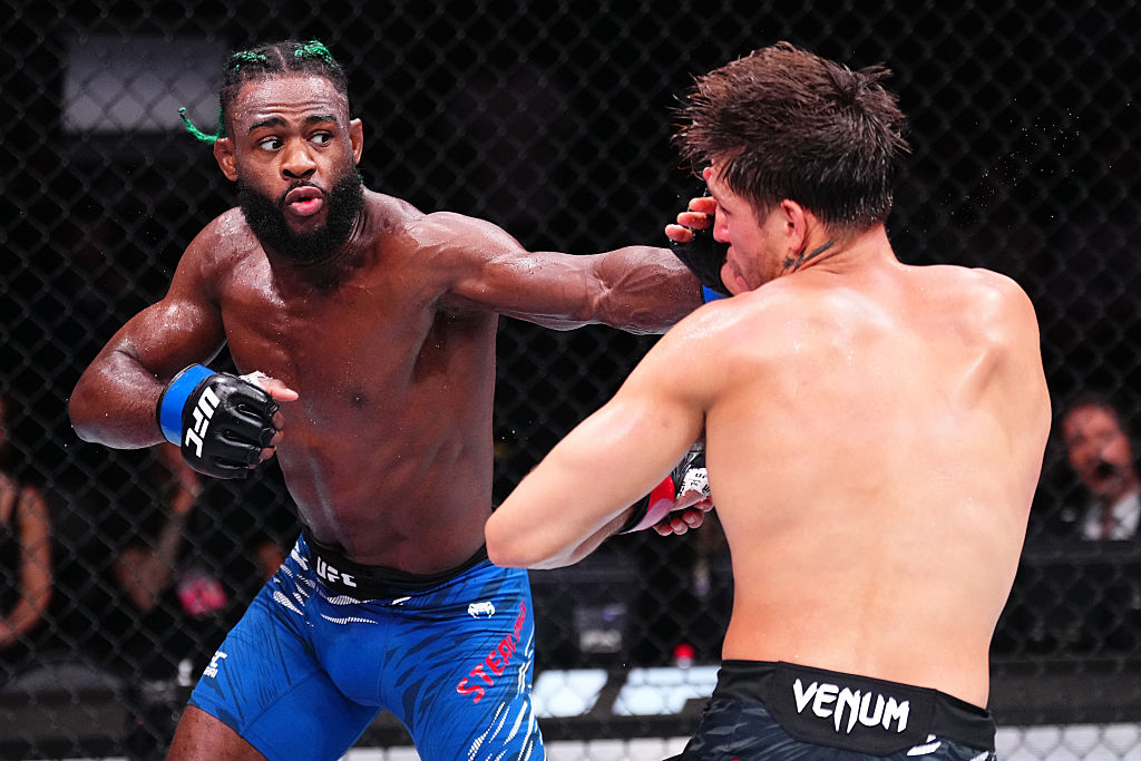 SHANGHAI, CHINA - AUGUST 23: (L-R) Aljamain Sterling punches Brian Ortega in a 153-pound catchweight fight during the UFC Fight Night event at Shanghai Indoor Stadium on August 23, 2025 in Shanghai, China. (Photo by Jeff Bottari/Zuffa LLC)