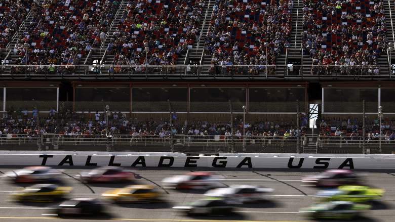 Cars race past the grandstands at Talladega Superspeedway during a NASCAR Cup Series event