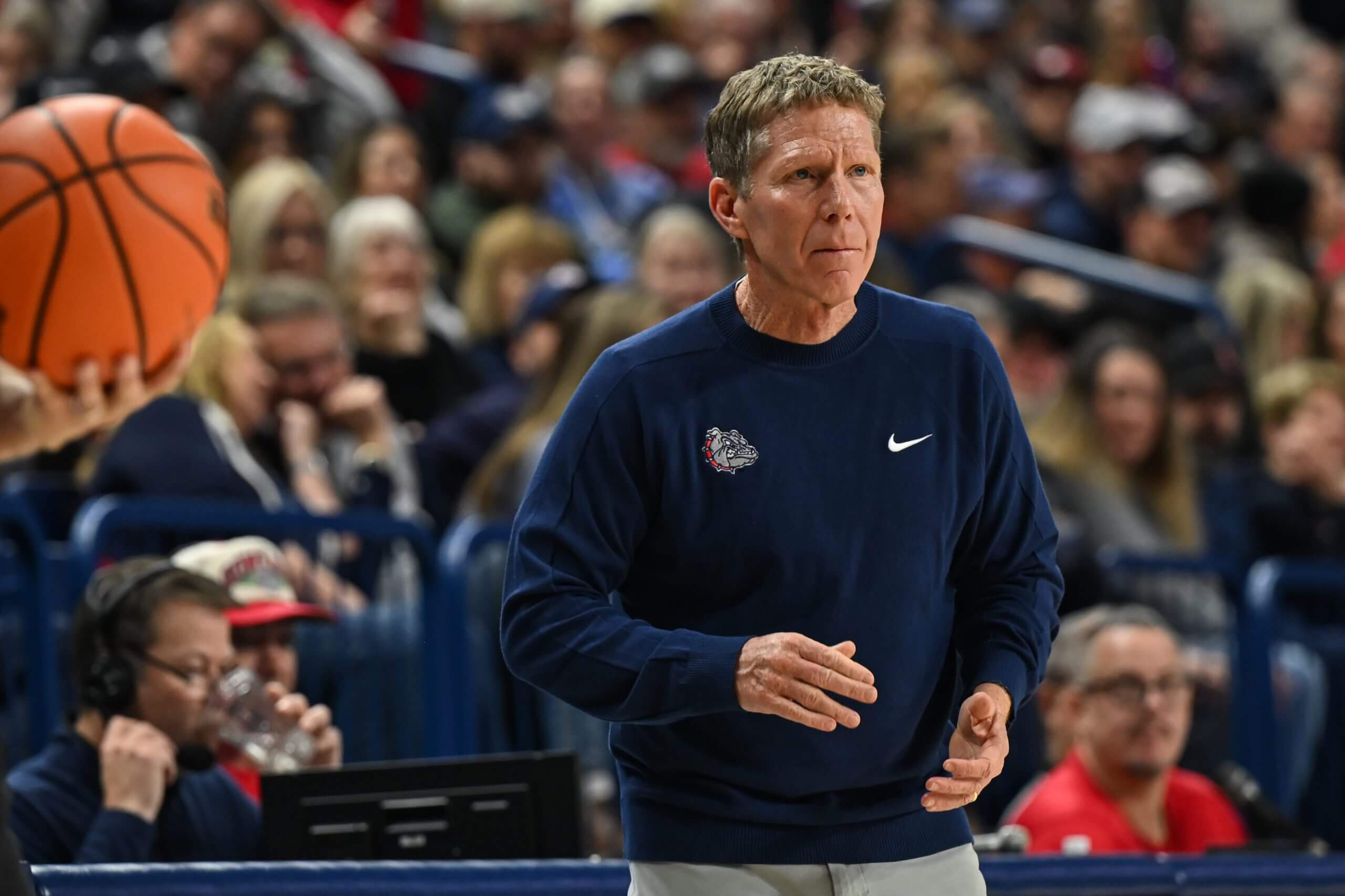 Head coach Mark Few of the Gonzaga Bulldogs coaches along the sideline.