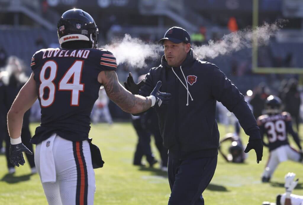Bears tight end Colston Loveland greets coach Ben Johnson before a 2025 game in Chicago.