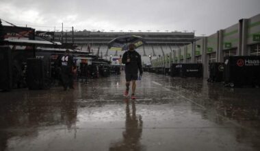 Rain-soaked NASCAR Cup Series garage area during a weather delay at Atlanta Motor Speedway