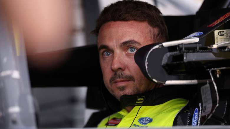 Frankie Muniz at a NASCAR Truck Series race wearing racing suit