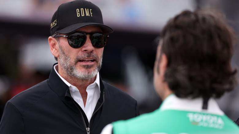 Jimmie Johnson speaks with a driver during NASCAR race weekend in St. Petersburg, Florida