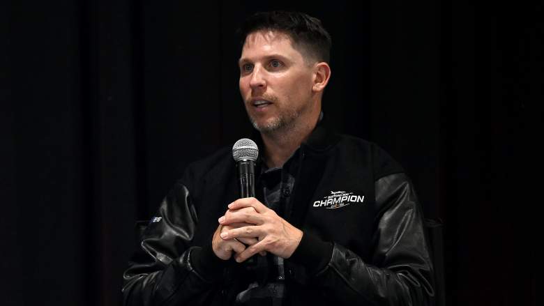Denny Hamlin speaking into a microphone at a NASCAR event