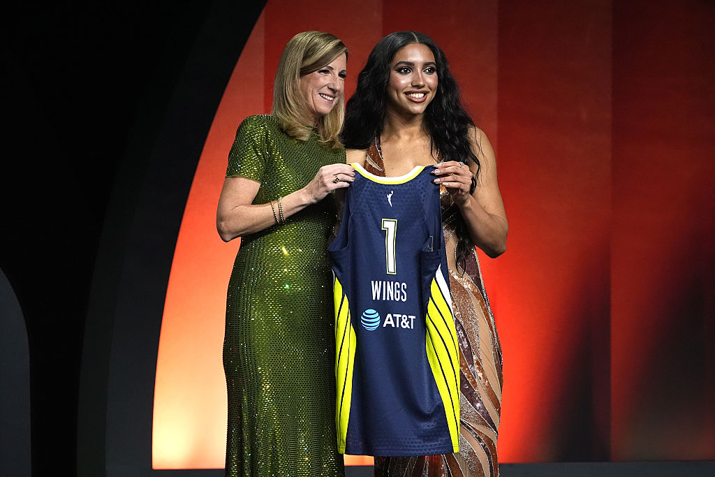 NEW YORK, NEW YORK - APRIL 13: Azzi Fudd of UConn poses with WNBA Commissioner Cathy Engelbert after being selected with the 1st pick in the first round by the Dallas Wings during the 2026 WNBA Draft at The Shed on April 13, 2026 in New York City.