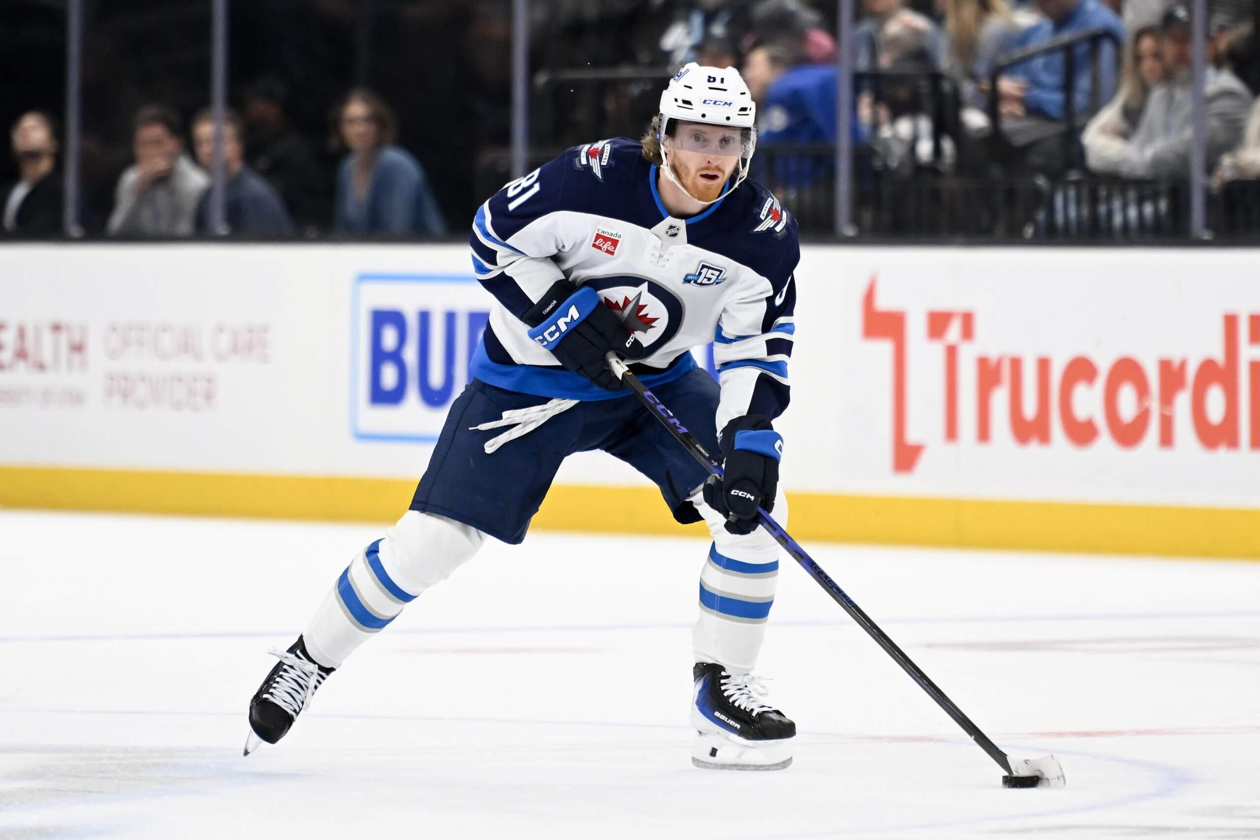 Kyle Connor of the Winnipeg Jets skates with the puck.