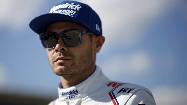 Kyle Larson looks on during qualifying at Kansas Speedway after setting laps led record