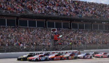NASCAR Cup Series cars racing in tight pack at Talladega Superspeedway