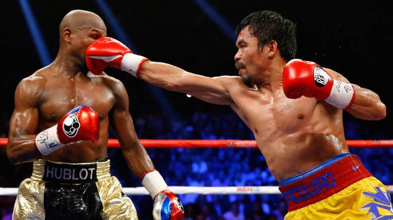 Manny Pacquiao punches Floyd Mayweather during 2015 fight