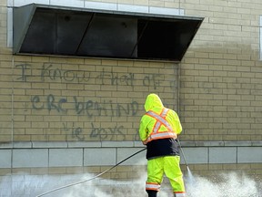 Graffiti is removed frm Mississauga’s St. Aloysius Gonzaga Secondary School.